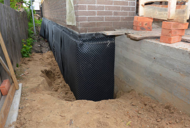Happy homeowners after waterproofing job in Troutdale